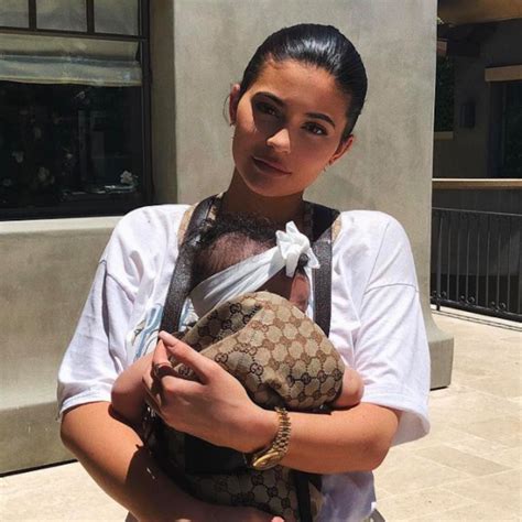 gucci baby carrier kylie jenner|Kylie Jenner Holds Baby Stormi in an $820 Gucci Baby Carrier.